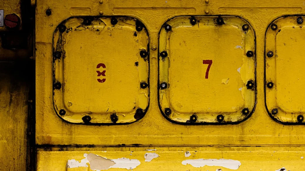 a printed sheet of numeric backup codes on a desk