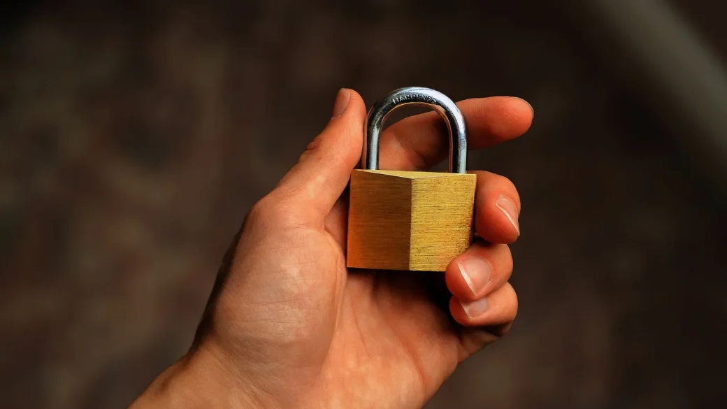 A padlock resting on a printed envelope symbolizing a secured inbox