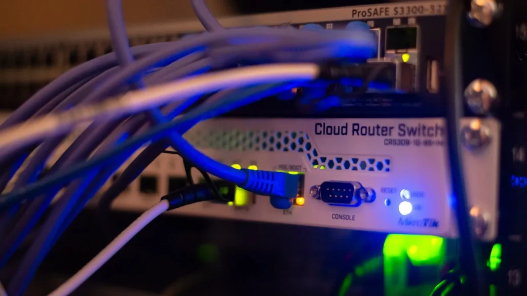 hands typing a new router admin password on a laptop