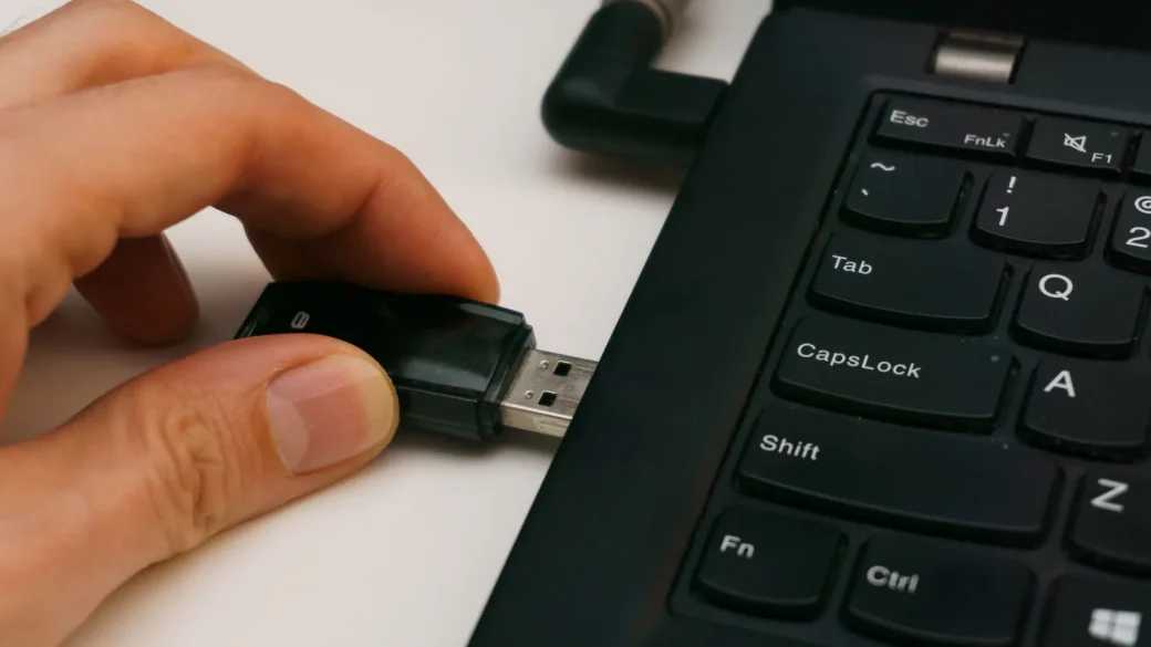 laptop showing a file being moved between two windows