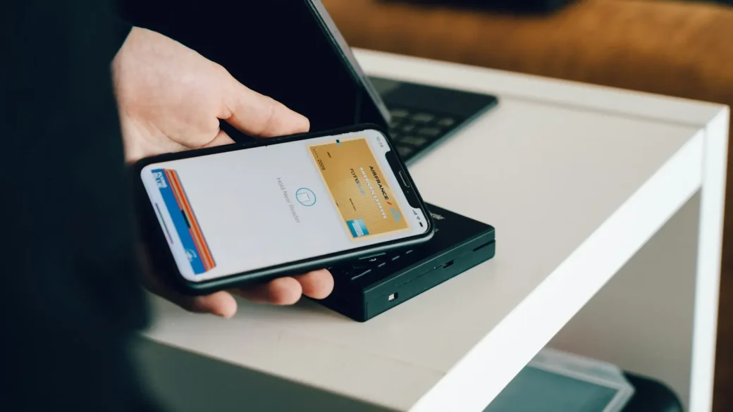 person paying on phone for a marketplace item