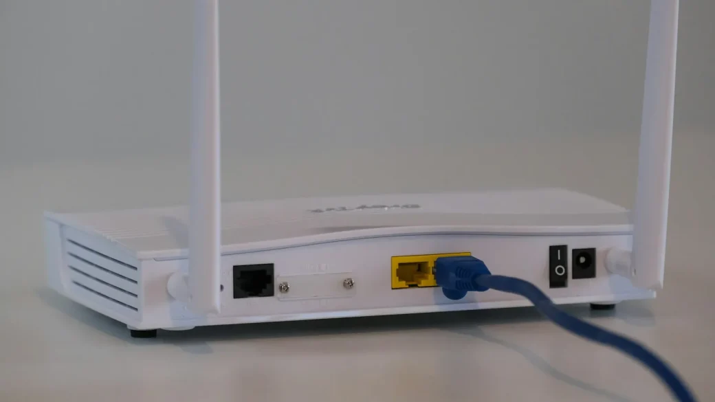 a parent adjusting parental control settings on a home router