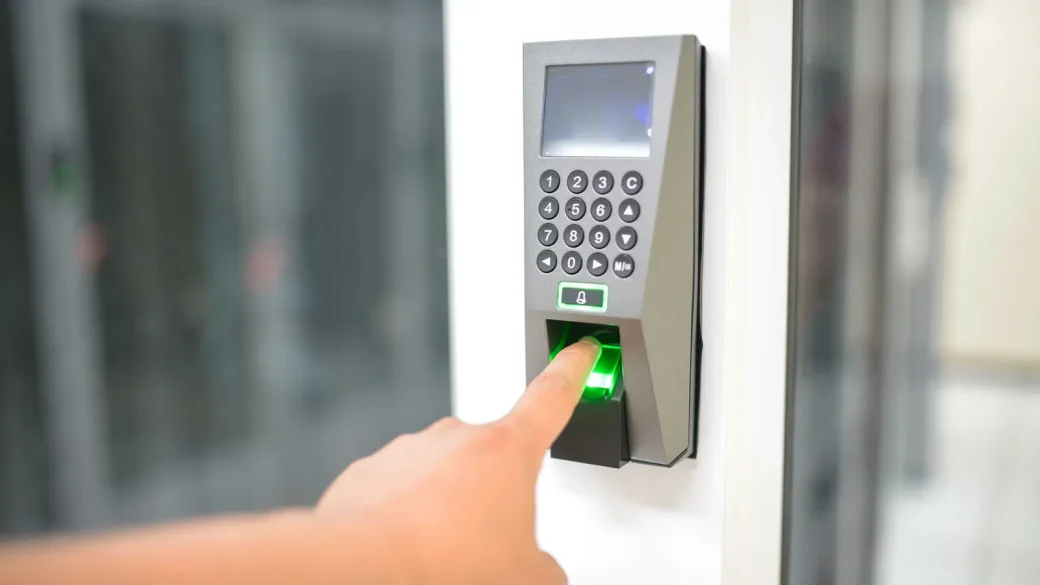 Person unlocking a phone with a fingerprint to sign in