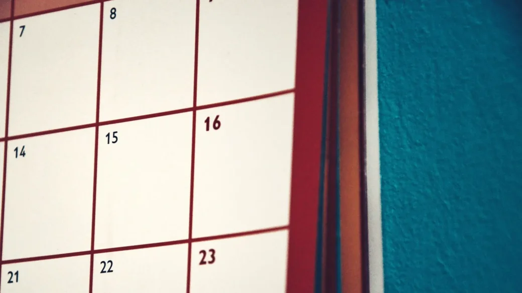 A wall calendar with a date circled in red marker