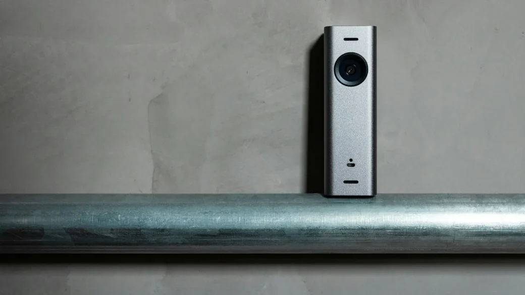 smart doorbell camera mounted beside a front door
