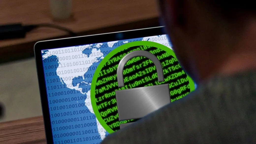 glowing padlock over lines of computer code representing a patched flaw